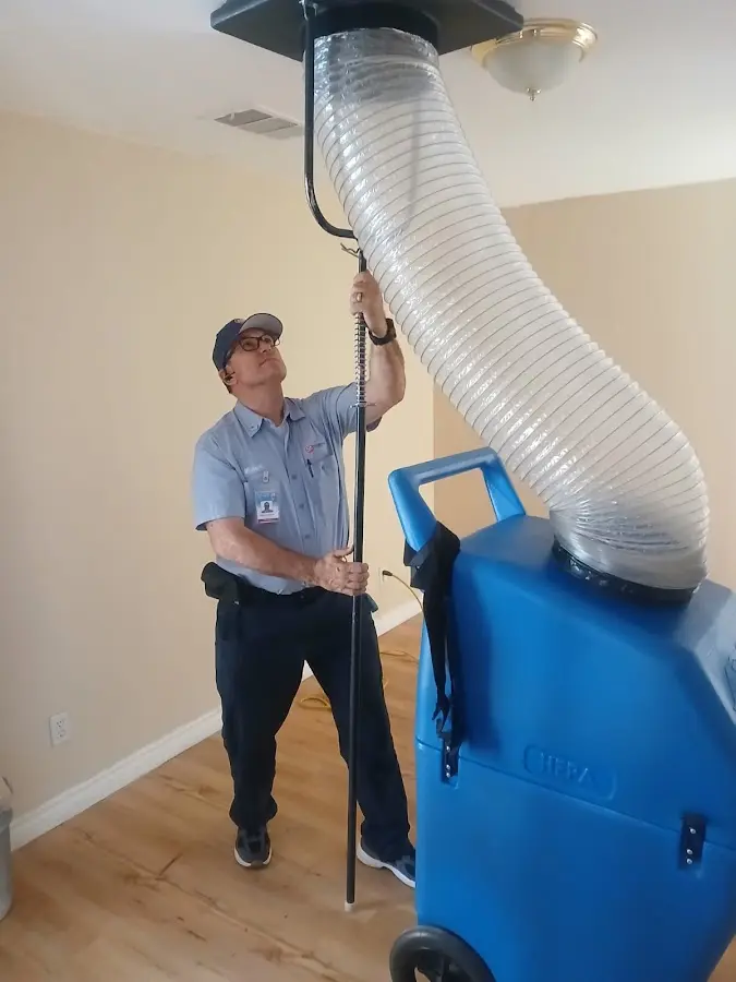 Furnace Tune-Up technician using HEPA equipment in Winter Garden